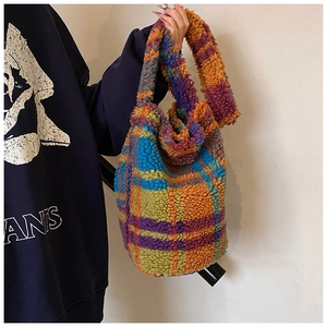 Detail of soft plush tote bag featuring vibrant colorful checkered pattern texture