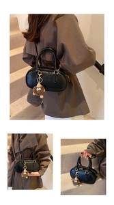 Vue détaillée du sac Boston noir en similicuir avec logo ATN et accessoires dorés