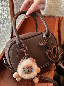 Minimalist brown boston handbag with white contrast stitching and heart charms