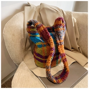 Detail of colorful patchwork lamb wool tote bag with plush texture and vibrant panels