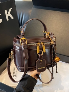 Vintage chocolate brown box bag in shiny leather with gold hardware and top handle