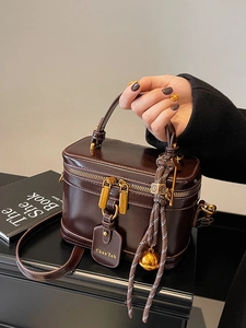 Retro dark brown box-style top handle handbag with elegant braided tassel and shoulder strap