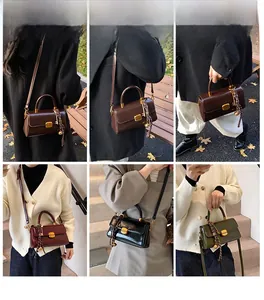 Detail of square crossbody bags with scarf-wrapped handle and gold metallic buckles