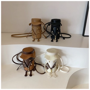Detailed view of creative cylindrical bags featuring cartoon characters and hat lids