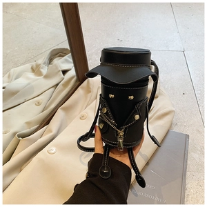 Detailed close-up of a creative cartoon hoodie-style mini crossbody bag in black leather