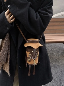 Unique cartoon cylinder shoulder bag in brown and black leather with cute character design