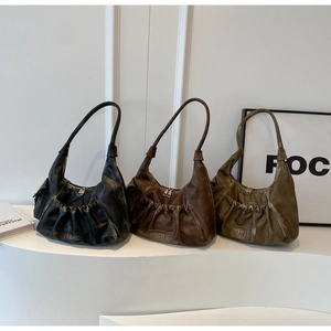 Detailed comparison of pleated faux leather shoulder bags in black, brown, and olive green