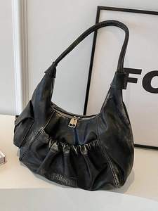 Retro black oversized hobo bag with pleated leather detail and vintage shoulder strap