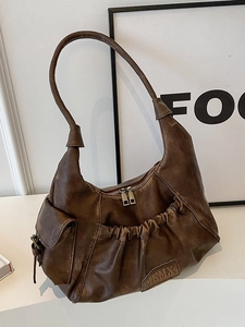 Vintage dark brown wrinkled hobo bag with side pockets and retro leather texture