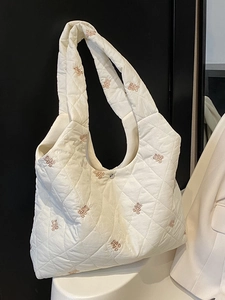White quilted tote bag with cute bear embroidery and spacious design for women