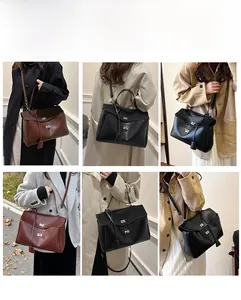 Detail of elegant flap handbags in dark brown and black featuring metallic clasps