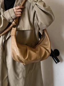 Retro oversized pleated dumpling bag in soft beige PU leather with knotted shoulder strap
