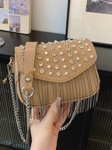 Khaki square crossbody bag with silver studs and tassel fringe in a trendy chic style