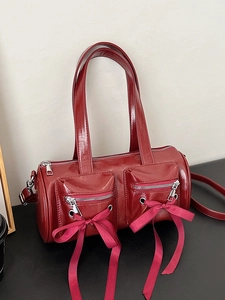 Sac Boston en cuir verni bordeaux avec nœuds en ruban et doubles poignées femme