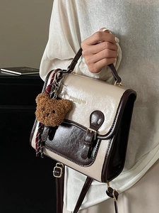 Vintage style square handbag in cream and dark brown faux leather with teddy bear charm