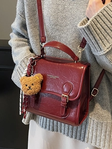 Retro burgundy leather crossbody square bag with plush bear charm and adjustable strap