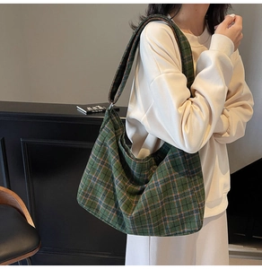 Close-up of green plaid tote bag showing soft woven fabric texture and pattern