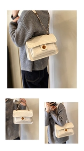 Close-up of white quilted crossbody bag featuring a gold rotary clasp and chain strap