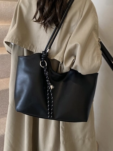 Chic vintage minimalist black leather tote bag for women with stylish silver hardware