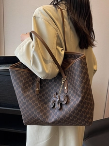Classic brown large tote bag with MK print and leather straps for professional women