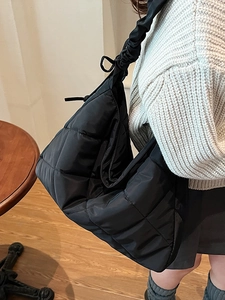 Chic black quilted puffer tote bag with ruffled strap for women casual daily shoulder use