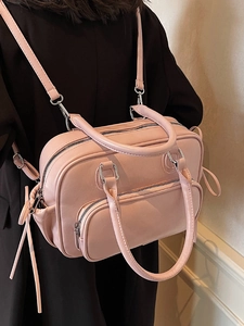 Pink faux leather bowling backpack with multi-pocket design and silver metal hardware