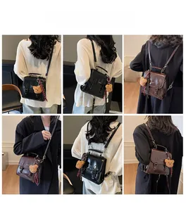 Model wearing vintage glossy flap square bag as backpack and crossbody in black and brown