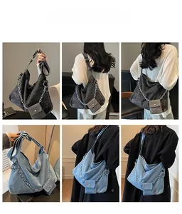 Detail view of large denim hobo bag featuring thick metal chain and matching coin purse