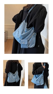 Detail view of denim hobo bag with silver chain and a matching detachable mini pouch