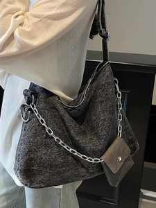 Washed denim tote bag with silver chain and coin purse for casual everyday use