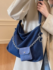 Deep blue denim tote bag with silver chain and mini pouch for casual daily commuting