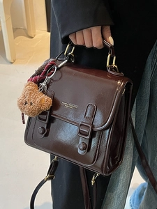 Retro dark brown glossy leather satchel handbag with cute plush bear charm for women