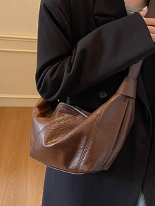 Retro brown oil wax leather dumpling shoulder bag for women with pleated design