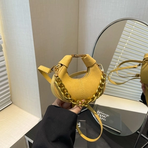 Minimalist bright yellow crescent bag with gold chain and suede finish for women