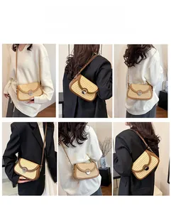 Detail showing the adjustable leather shoulder strap and metallic buckle on woven bag
