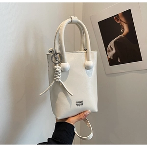 Detail of white oil-wax leather handbag with metallic logo and braided ornament