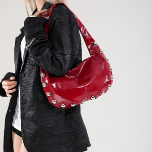 Trendy bright red hobo shoulder bag with silver rivet studs in shiny wax leather finish