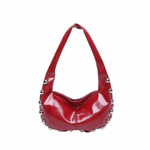 Red hobo shoulder bag with silver metal rivets on oily wax leather for a trendy biker style
