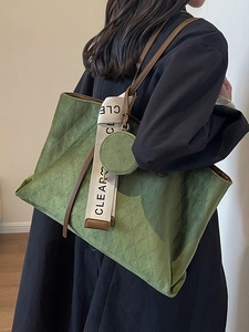 Retro dark green quilted tote bag with brown handles and a small round coin purse