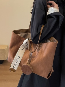 Brown quilted suede tote bag with wide strap and matching round coin purse detail