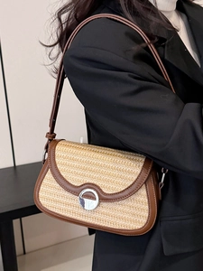 Fashionable contrast woven shoulder bag with brown leather trim and silver round buckle
