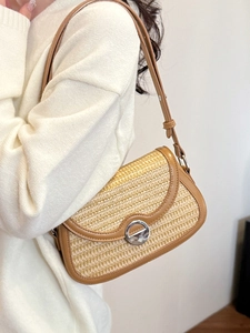Stylish hand-woven shoulder bag in yellow with brown leather trim and silver buckle