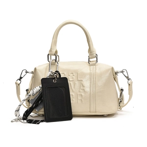 Creamy leather bowling bag with GLVAGR embossing and woven rope charm detail