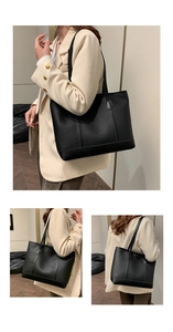 Detalle de bolso tote de cuero granulado negro con correas de hombro y costuras minimalistas