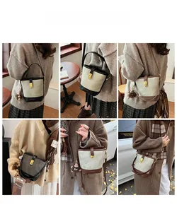 Lifestyle view showing canvas and leather bucket bag with bear charm in various colors