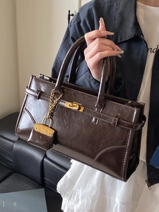 British vintage dark coffee oil wax leather handbag with golden lock and small charm