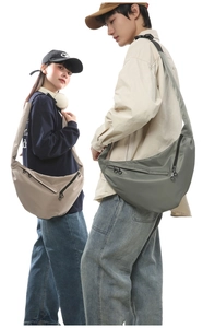 Detail showing high-capacity dumpling cross-body bags with adjustable wide shoulder straps