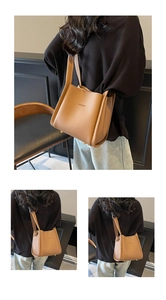 Detail of caramel lychee grain leather tote bag showing golden studs and brand logo