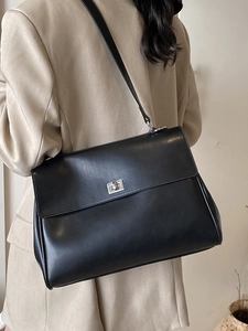 Minimalist black briefcase shoulder bag for women with silver rotating lock closure