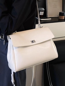 Minimalist beige PU leather office tote bag with silver metal twist lock and shoulder strap